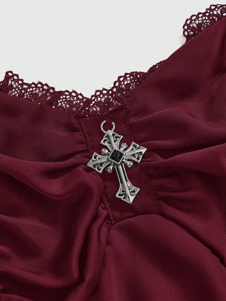 Women's vintage gothic cami dress with high-waist lace-up detail, spaghetti straps, zipper closure, and an asymmetrical knee-length hem.
