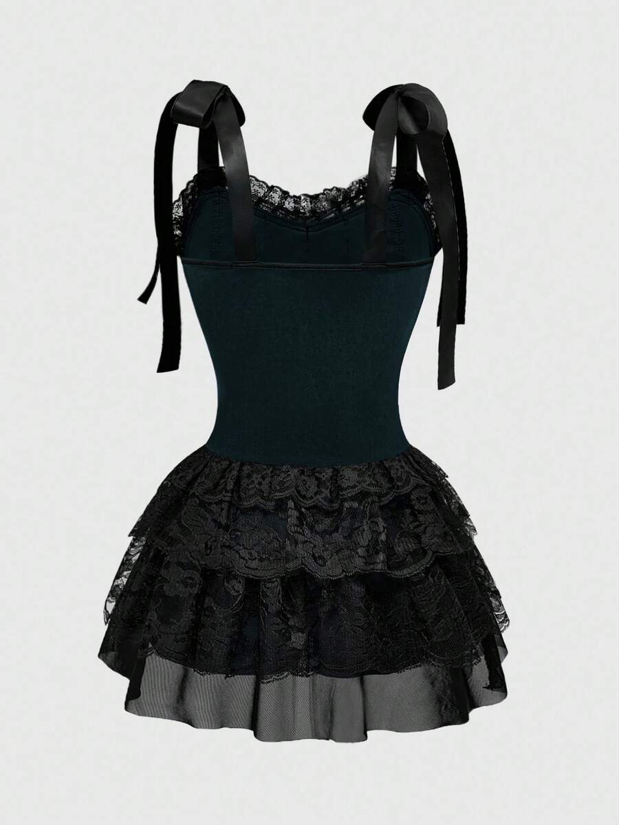 Gothic velvet halter mini dress with contrast lace trim, bow detail, lace-up accents, arm sleeves, layered hem, and cross pendant.