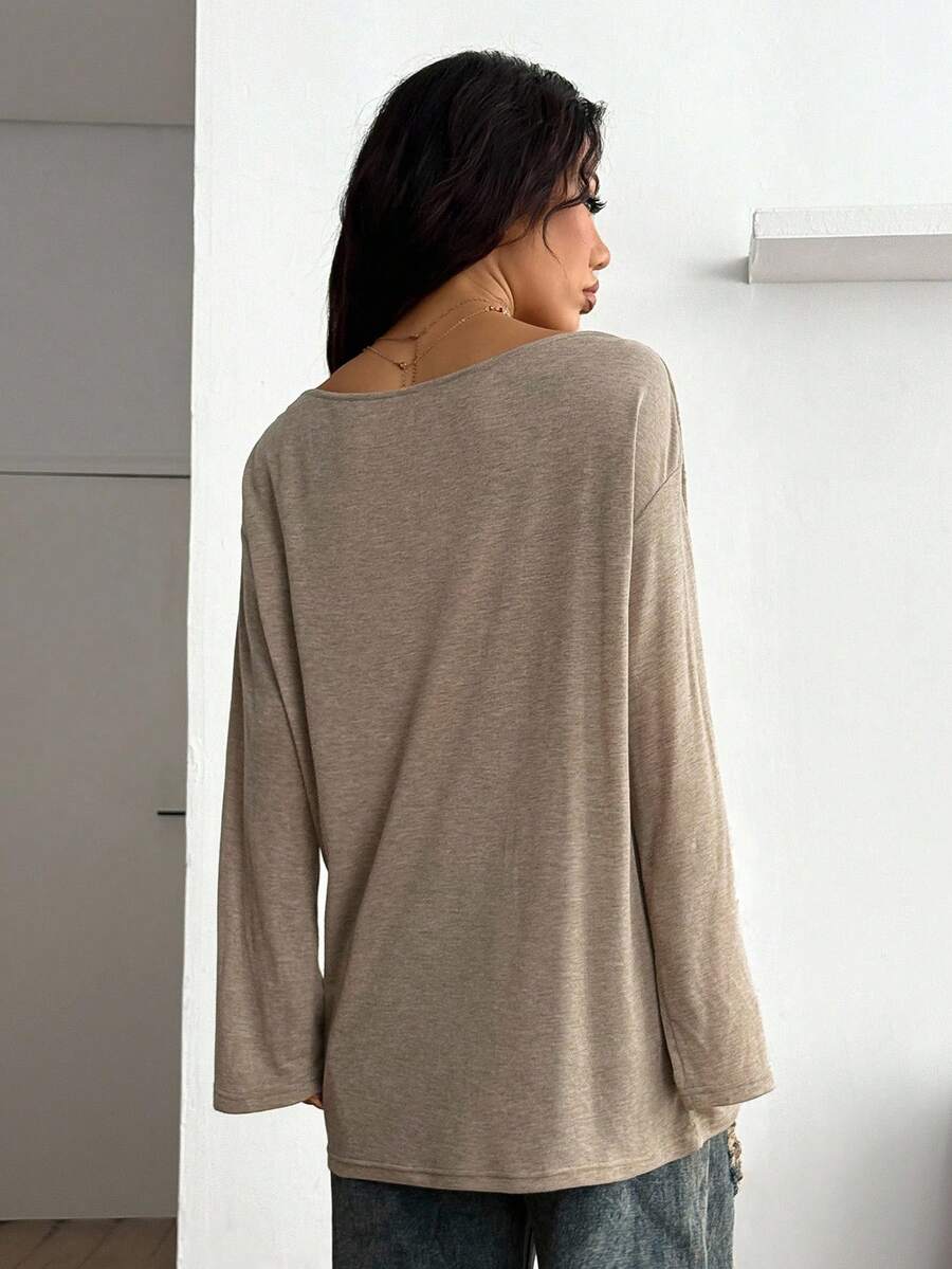 Women's brown striped boat neck long sleeve raglan T-shirt with a loose casual fit