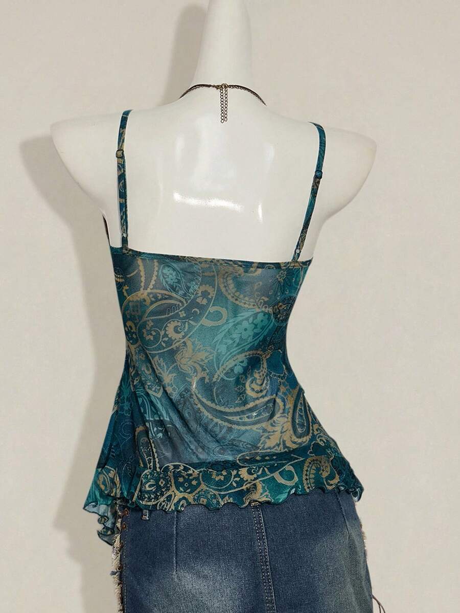 Women's graphic print camisole top featuring thin spaghetti straps, a backless cut, and an asymmetrical hem.