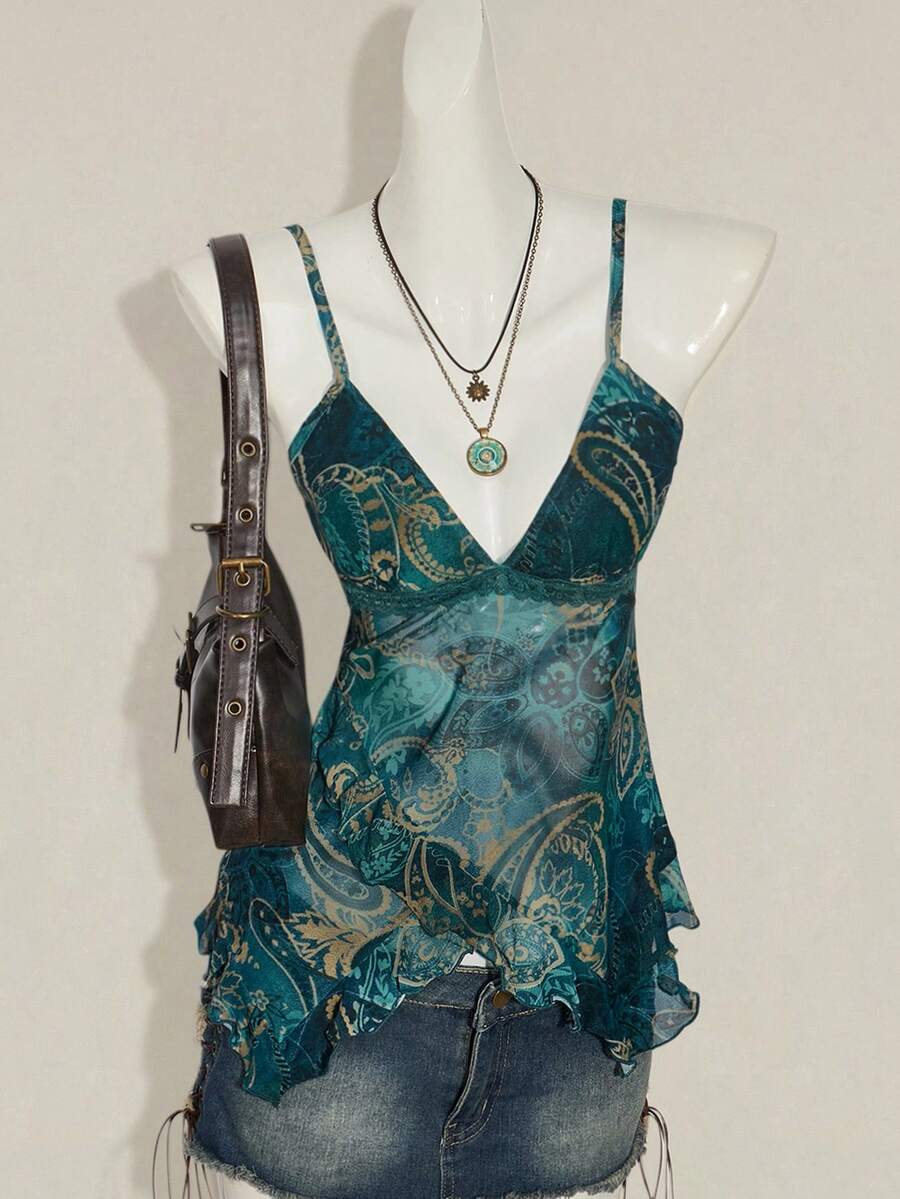 Women's graphic print camisole top featuring thin spaghetti straps, a backless cut, and an asymmetrical hem.