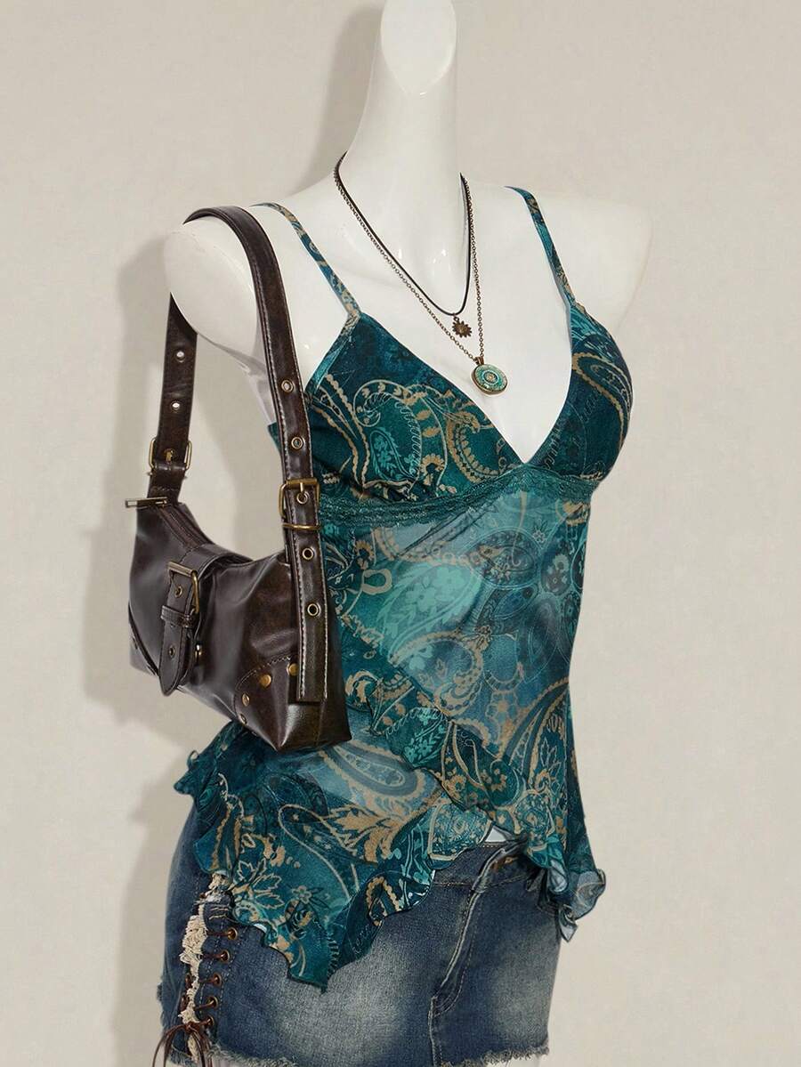 Women's graphic print camisole top featuring thin spaghetti straps, a backless cut, and an asymmetrical hem.