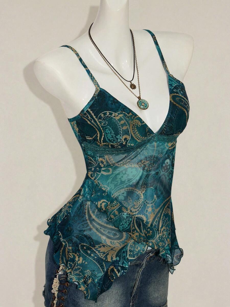 Women's graphic print camisole top featuring thin spaghetti straps, a backless cut, and an asymmetrical hem.