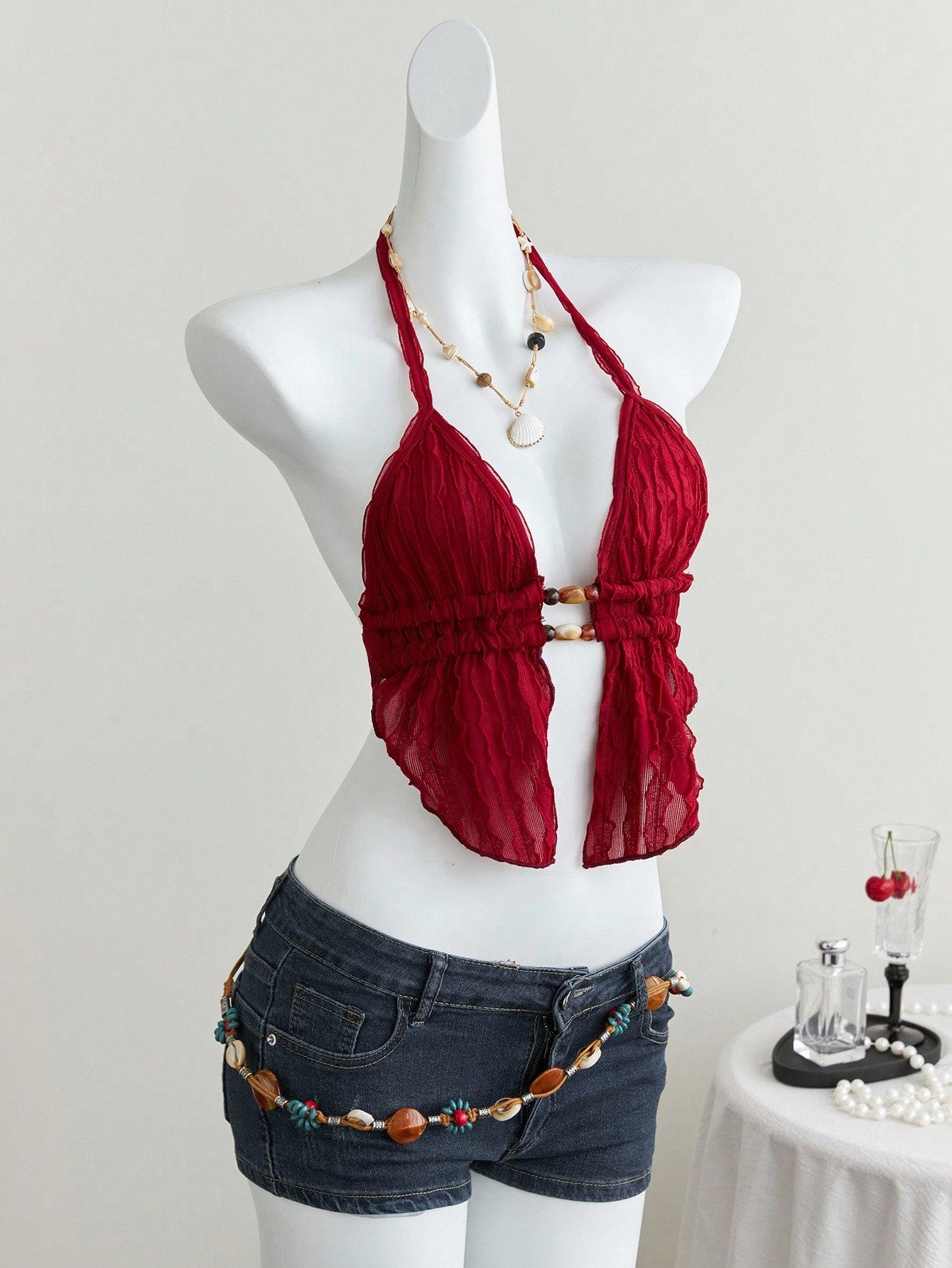 Women's textured halter camisole with pearl bead details, backless styling, asymmetrical hem, and micro crop slim fit