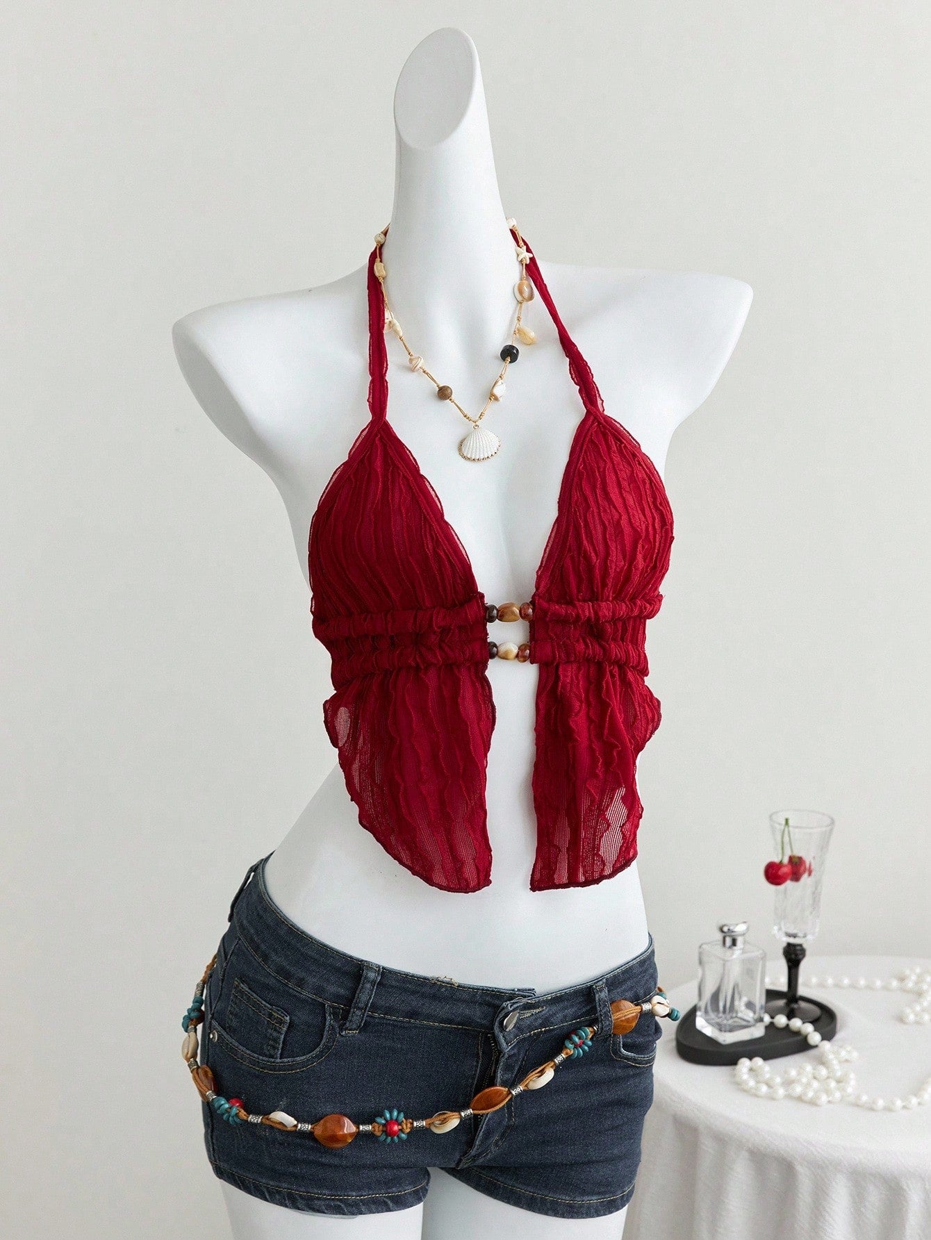 Women's textured halter camisole with pearl bead details, backless styling, asymmetrical hem, and micro crop slim fit