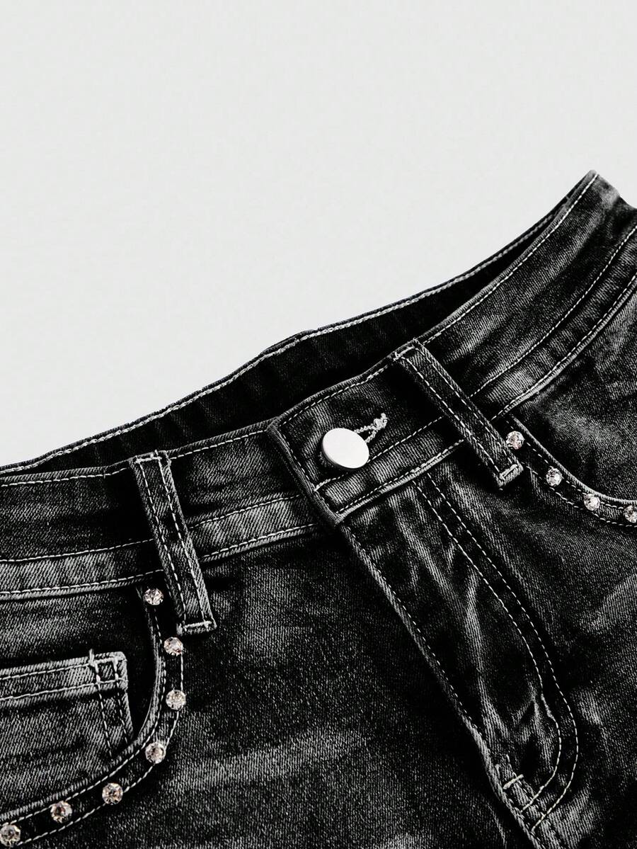 Women's ultra low waist skort with mini shorts length, zipper fly, pockets, pistol embroidery, and rhinestone details
