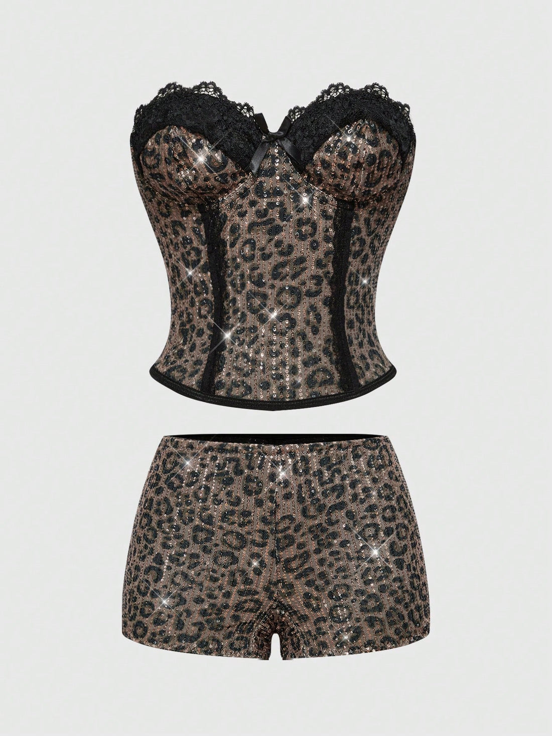 Black Y2K two-piece party set featuring a shiny sequin strapless micro crop bandeau top with cup details and bow, paired with matching lined mini shorts with contrast lace trim.