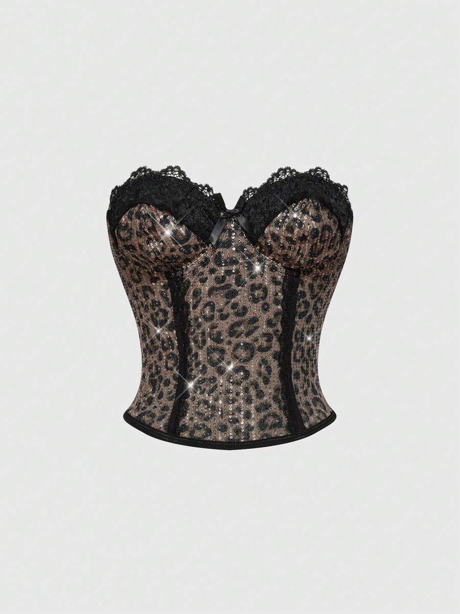 Black Y2K two-piece party set featuring a shiny sequin strapless micro crop bandeau top with cup details and bow, paired with matching lined mini shorts with contrast lace trim.