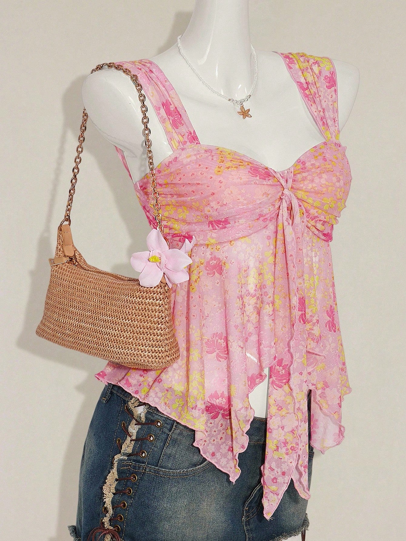 Women's white cherry print cami top with wide straps, ruched knot detail, and an asymmetrical hem
