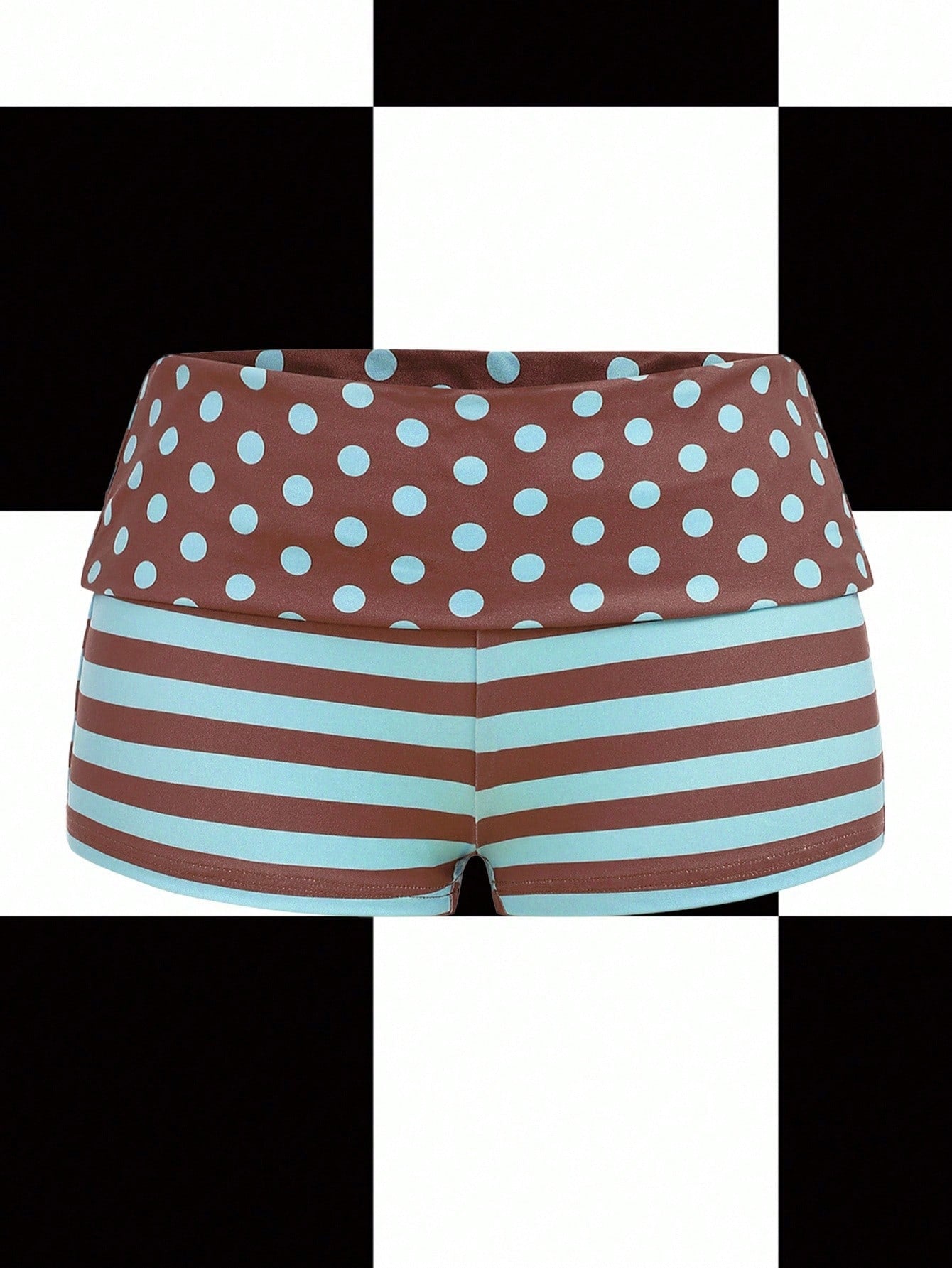 Women's black low waist mini track shorts with contrast polka dot, striped, geometric, and plant-inspired print details, elastic waistband, and skinny fit