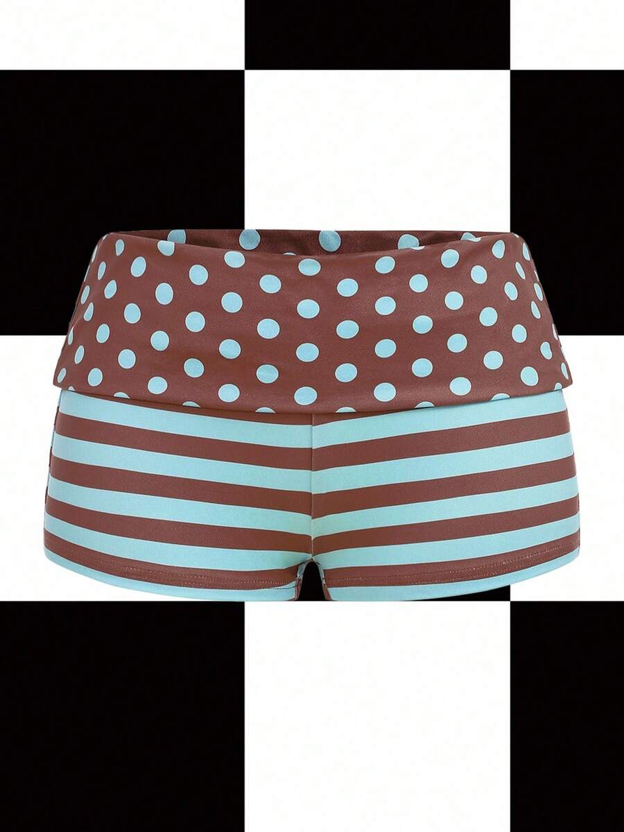 Women's black low waist mini track shorts with contrast polka dot, striped, geometric, and plant-inspired print details, elastic waistband, and skinny fit