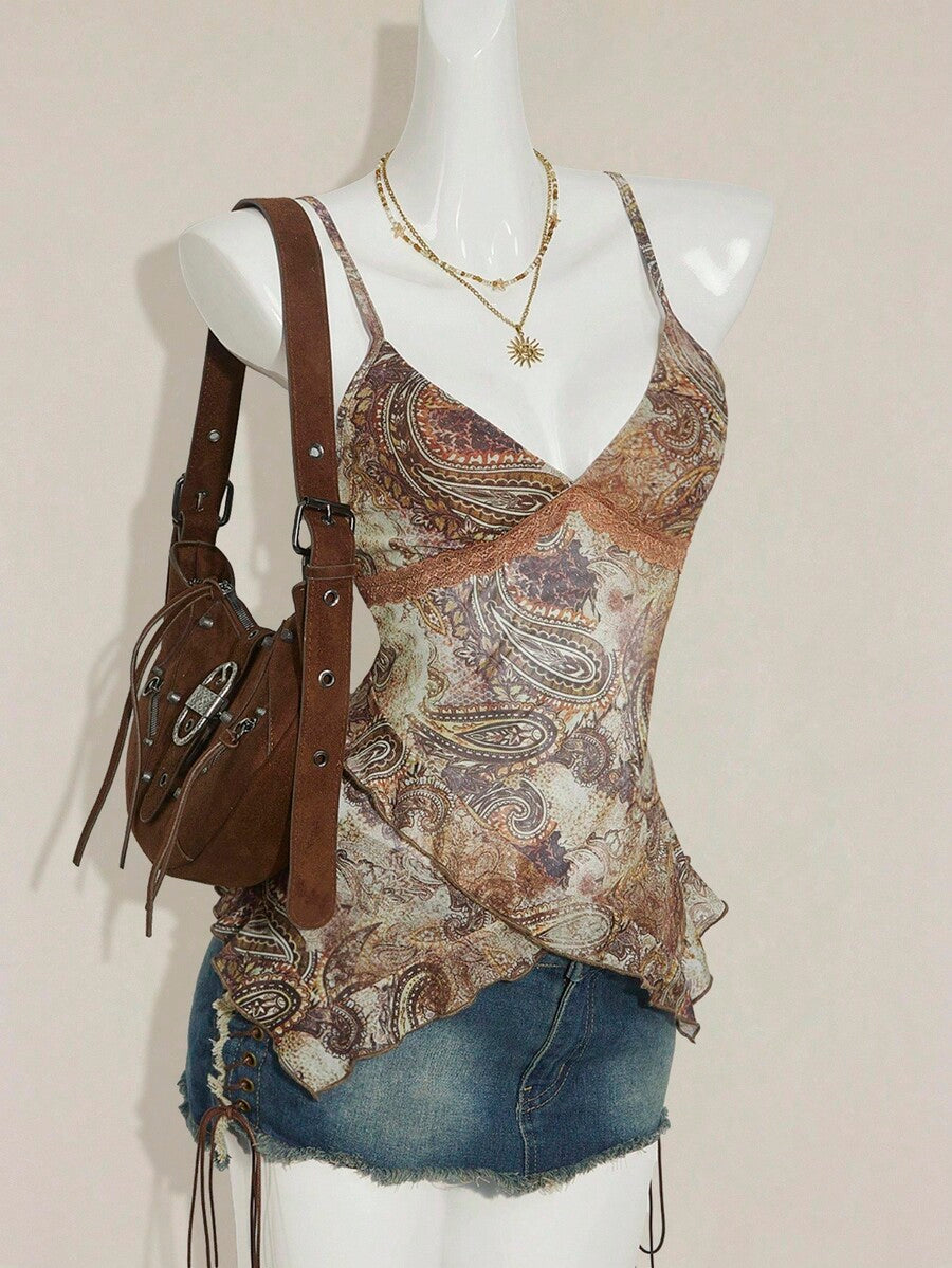 Women's graphic print camisole top featuring thin spaghetti straps, a backless cut, and an asymmetrical hem.