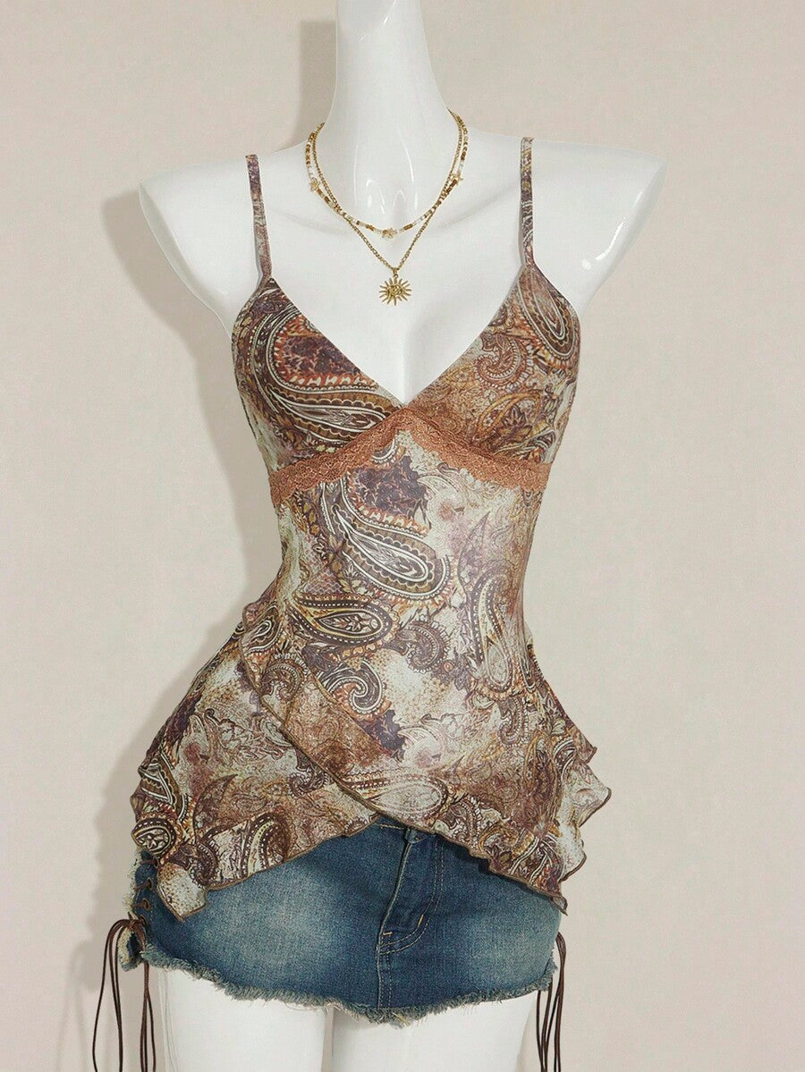 Women's graphic print camisole top featuring thin spaghetti straps, a backless cut, and an asymmetrical hem.