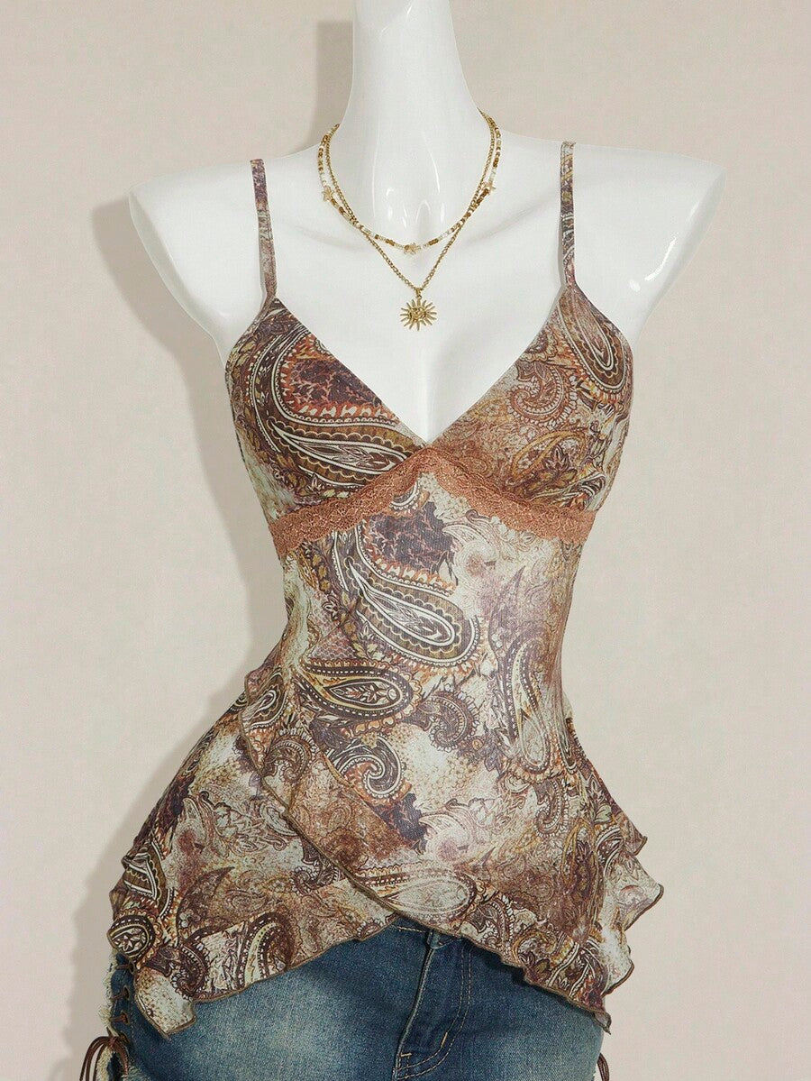 Women's graphic print camisole top featuring thin spaghetti straps, a backless cut, and an asymmetrical hem.
