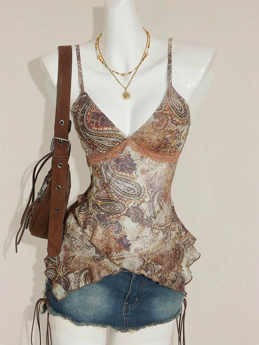 Women's graphic print camisole top featuring thin spaghetti straps, a backless cut, and an asymmetrical hem.