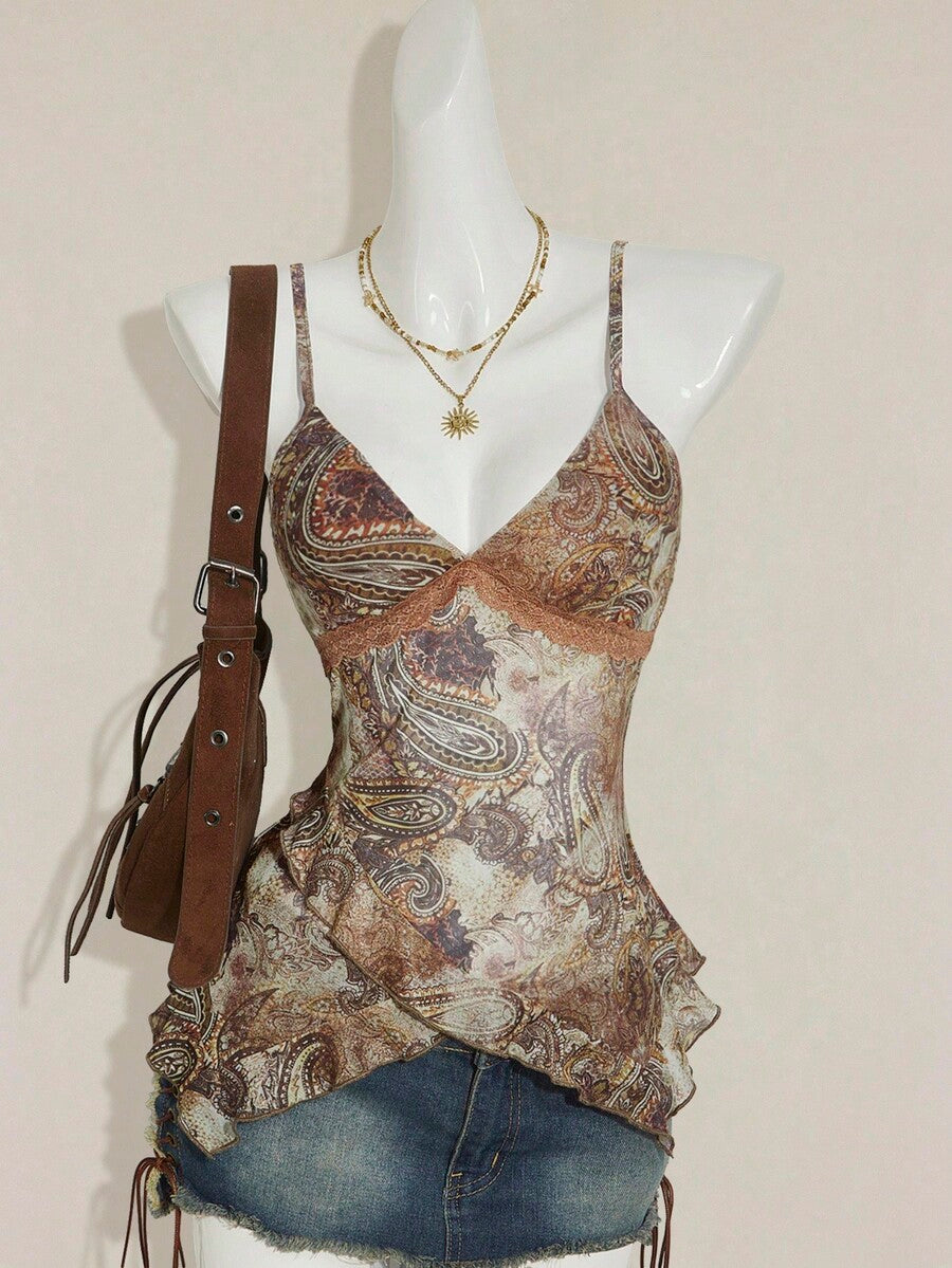 Women's graphic print camisole top featuring thin spaghetti straps, a backless cut, and an asymmetrical hem.
