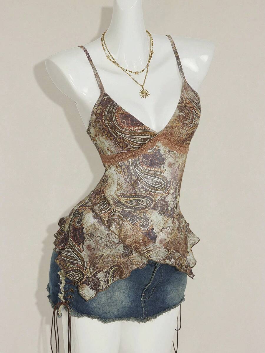 Women's graphic print camisole top featuring thin spaghetti straps, a backless cut, and an asymmetrical hem.