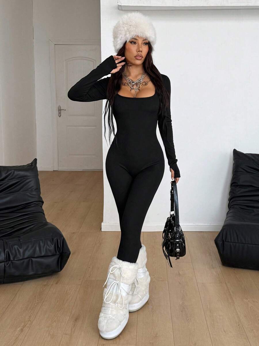 Black square neck long sleeve sport jumpsuit in rib-knit fabric with slim fit unitard silhouette for women.