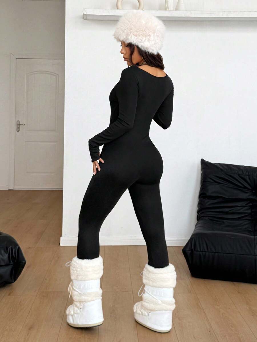 Black square neck long sleeve sport jumpsuit in rib-knit fabric with slim fit unitard silhouette for women.