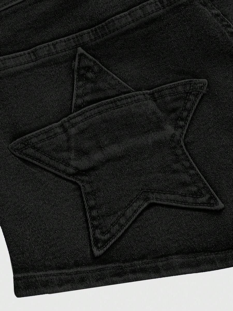 Women's ultra low waist mini shorts with back pockets, zipper fly, button detail, random print, and star patch in a grunge punk Y2K style.