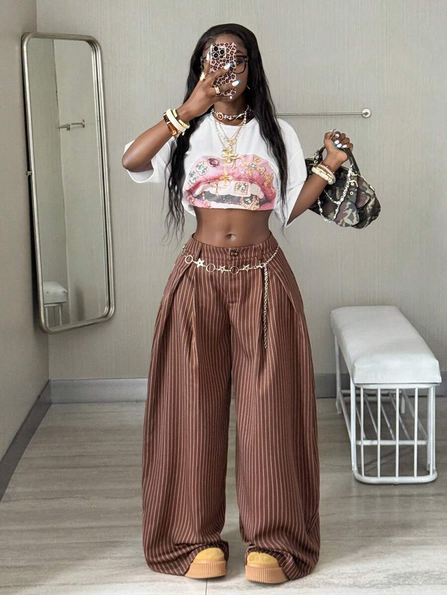 Women's brown striped wide leg pants with a low waist, curved hem, and loose casual fit in woven fabric.