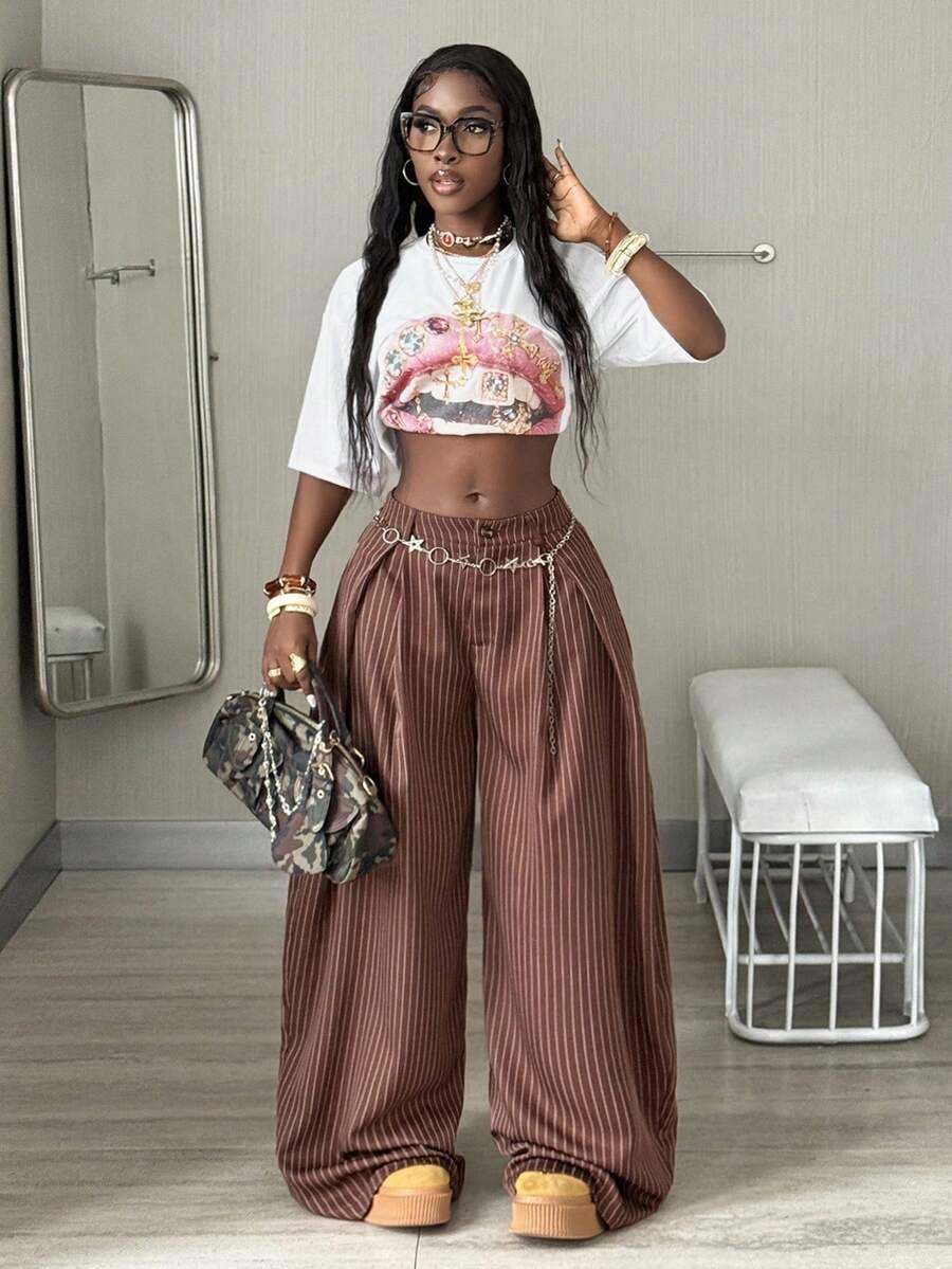 Women's brown striped wide leg pants with a low waist, curved hem, and loose casual fit in woven fabric.