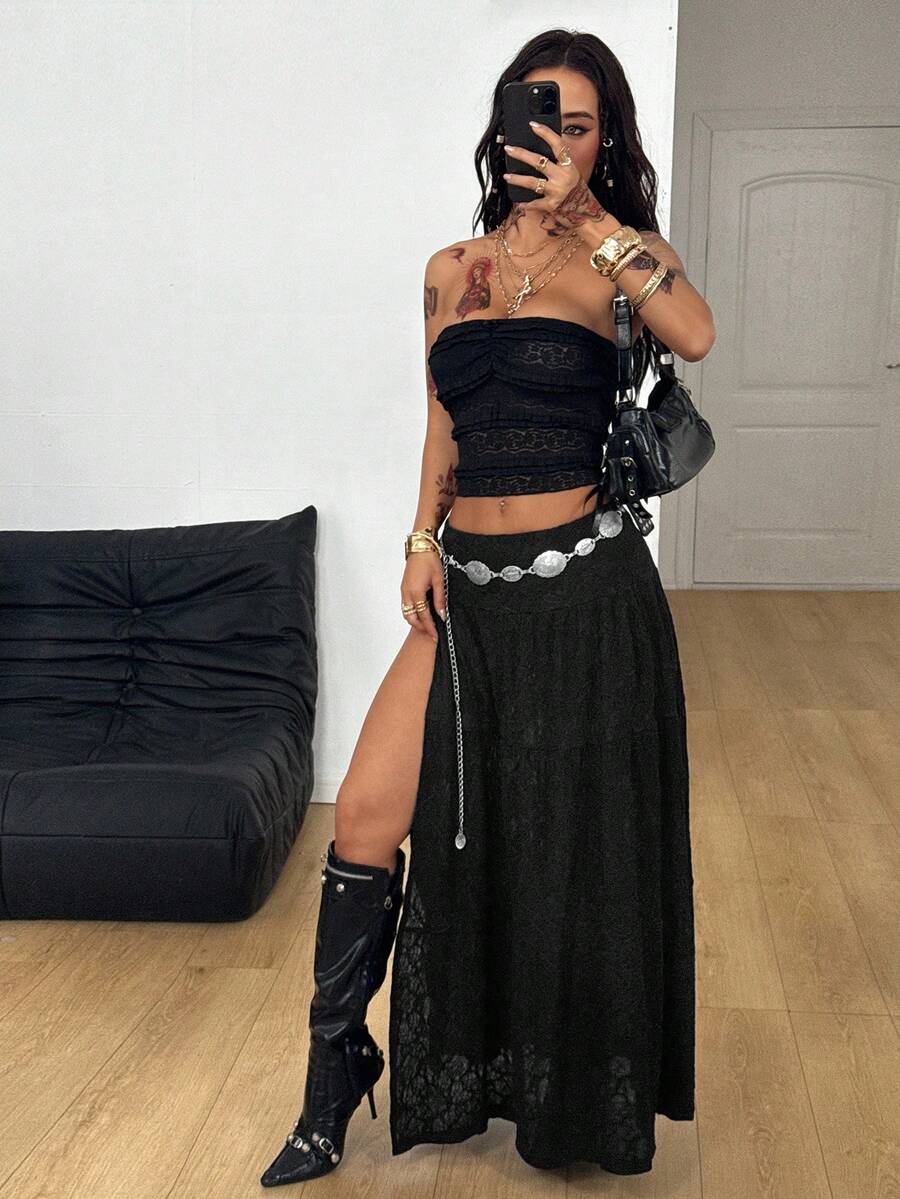 Women's red plaid long skirt featuring a low-rise waist and a side slit in lightweight woven fabric.