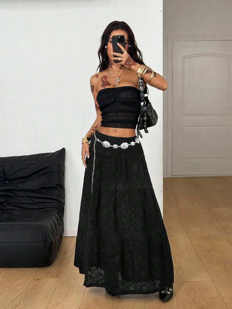 Women's red plaid long skirt featuring a low-rise waist and a side slit in lightweight woven fabric.