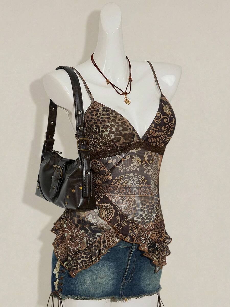 Women's graphic print camisole top featuring thin spaghetti straps, a backless cut, and an asymmetrical hem.