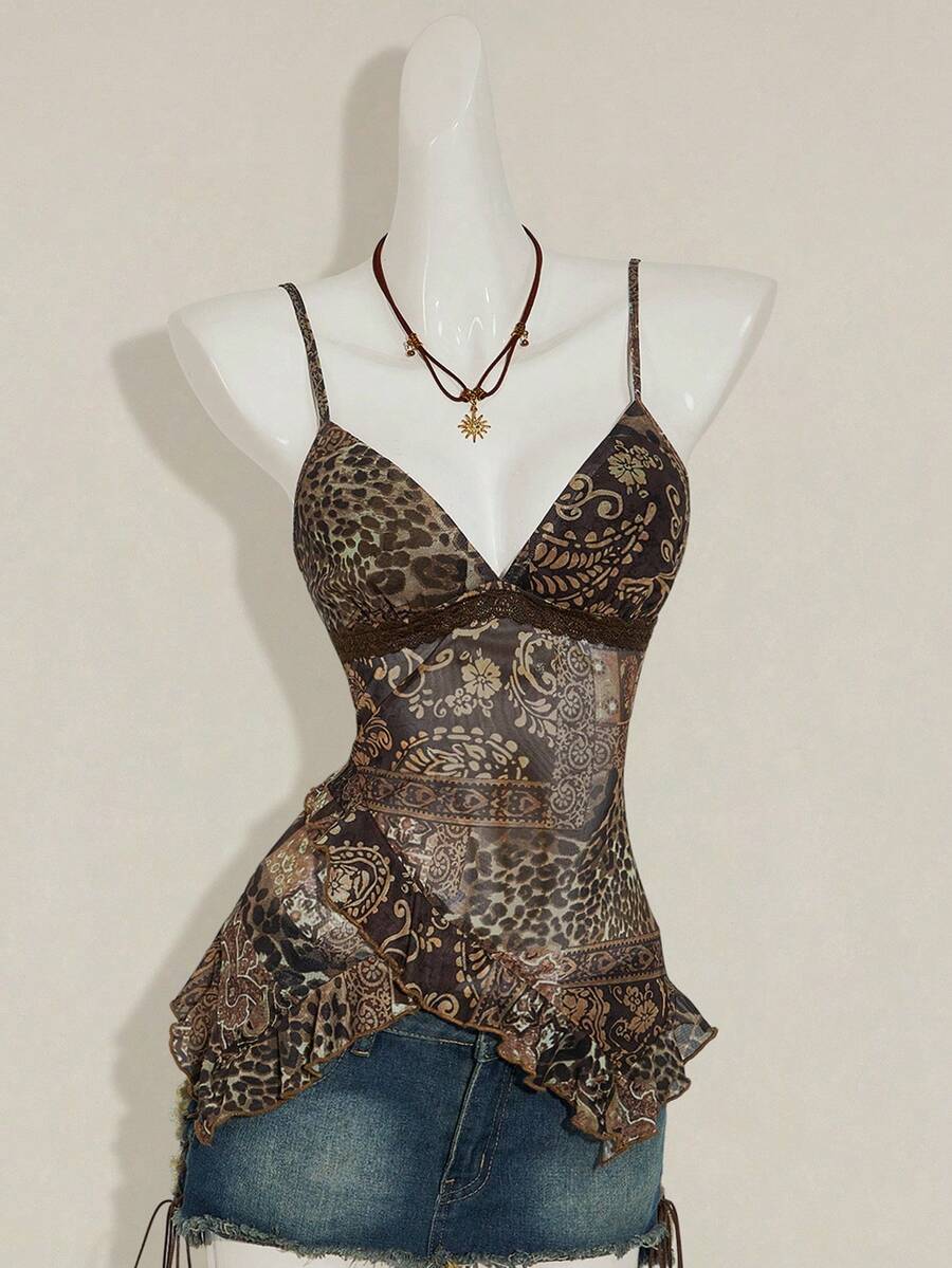 Women's graphic print camisole top featuring thin spaghetti straps, a backless cut, and an asymmetrical hem.