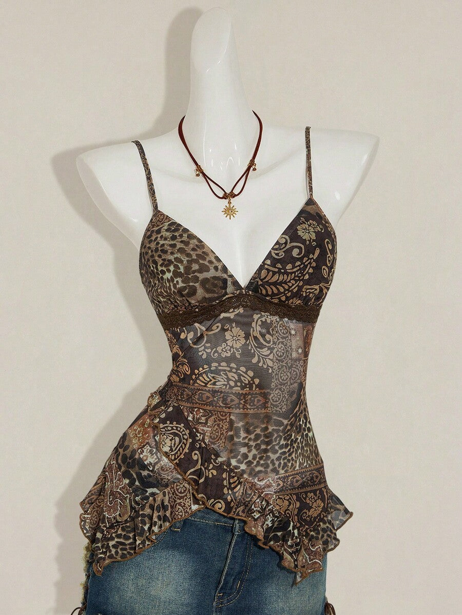 Women's graphic print camisole top featuring thin spaghetti straps, a backless cut, and an asymmetrical hem.