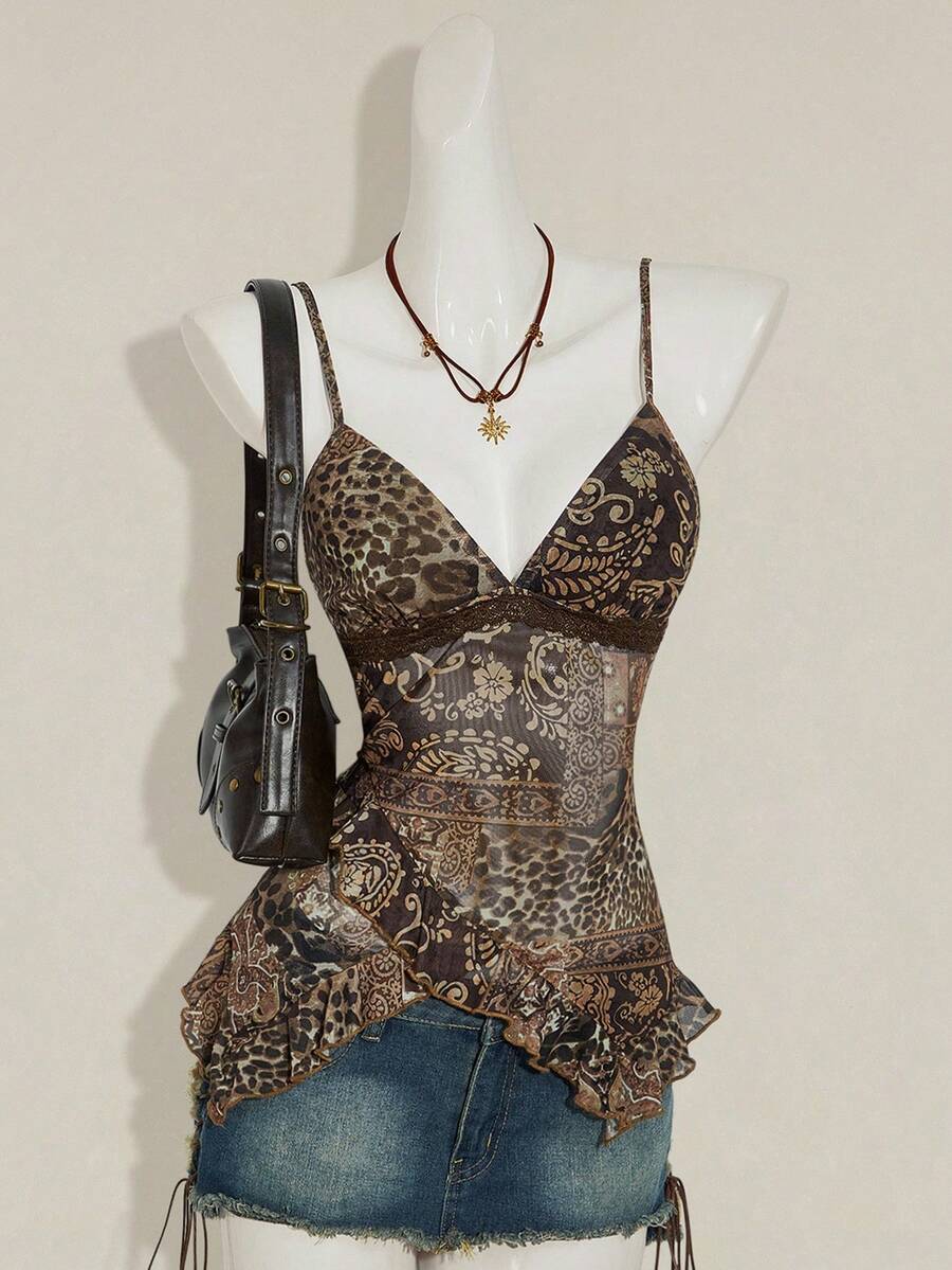 Women's graphic print camisole top featuring thin spaghetti straps, a backless cut, and an asymmetrical hem.