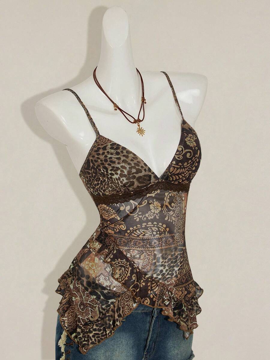 Women's graphic print camisole top featuring thin spaghetti straps, a backless cut, and an asymmetrical hem.