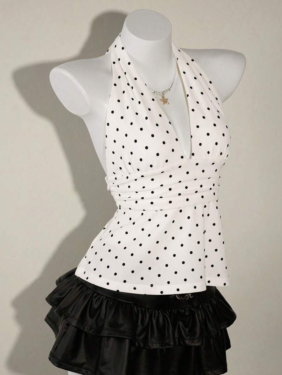 White women's deep V-neck halter tank top with ruched waist, backless design, rib-knit texture, and ruffle hem