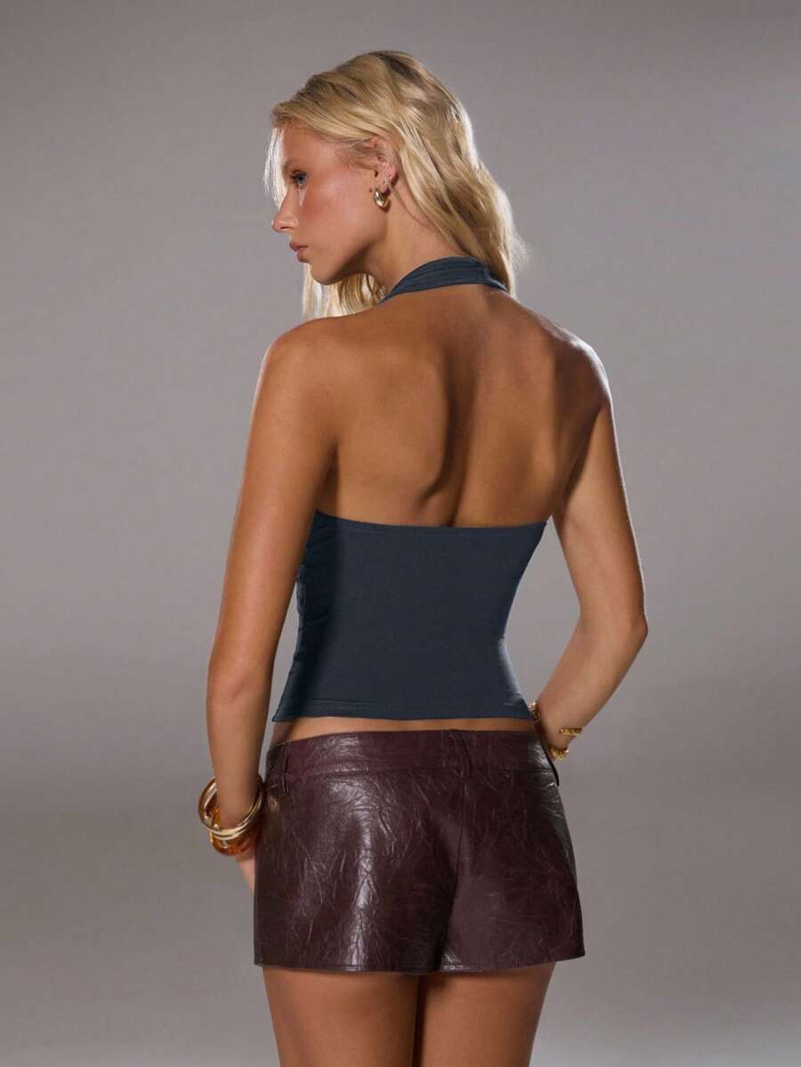 Dark grey women's halter neck tank top with ring detail, ruched front, slim fit, short length, and backless design