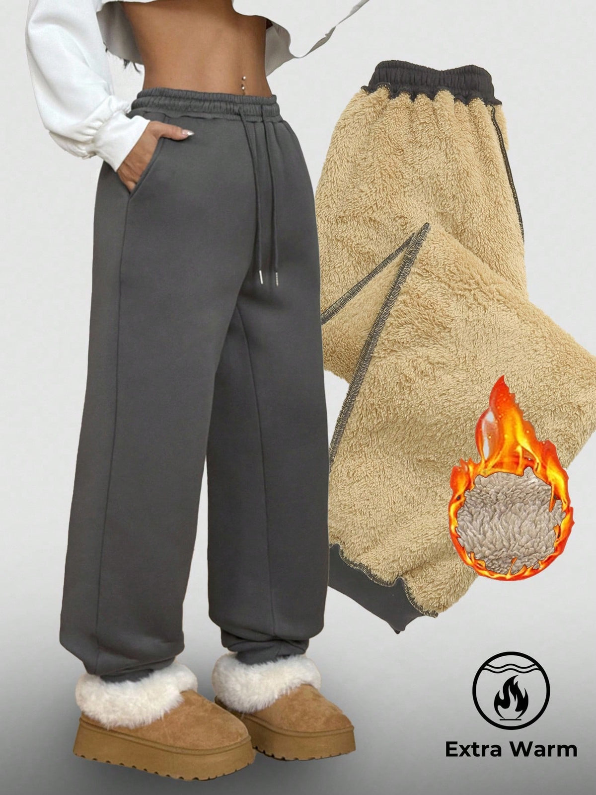 Women's casual grey jogger pants featuring a loose fit, mid-rise cut, and adjustable drawstring waistband.