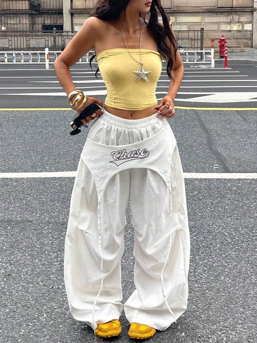 Women's loose fit wide leg parachute pants with elastic drawstring waist and side pockets