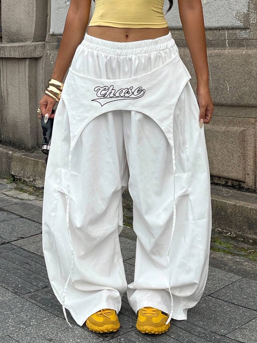 Women's loose fit wide leg parachute pants with elastic drawstring waist and side pockets