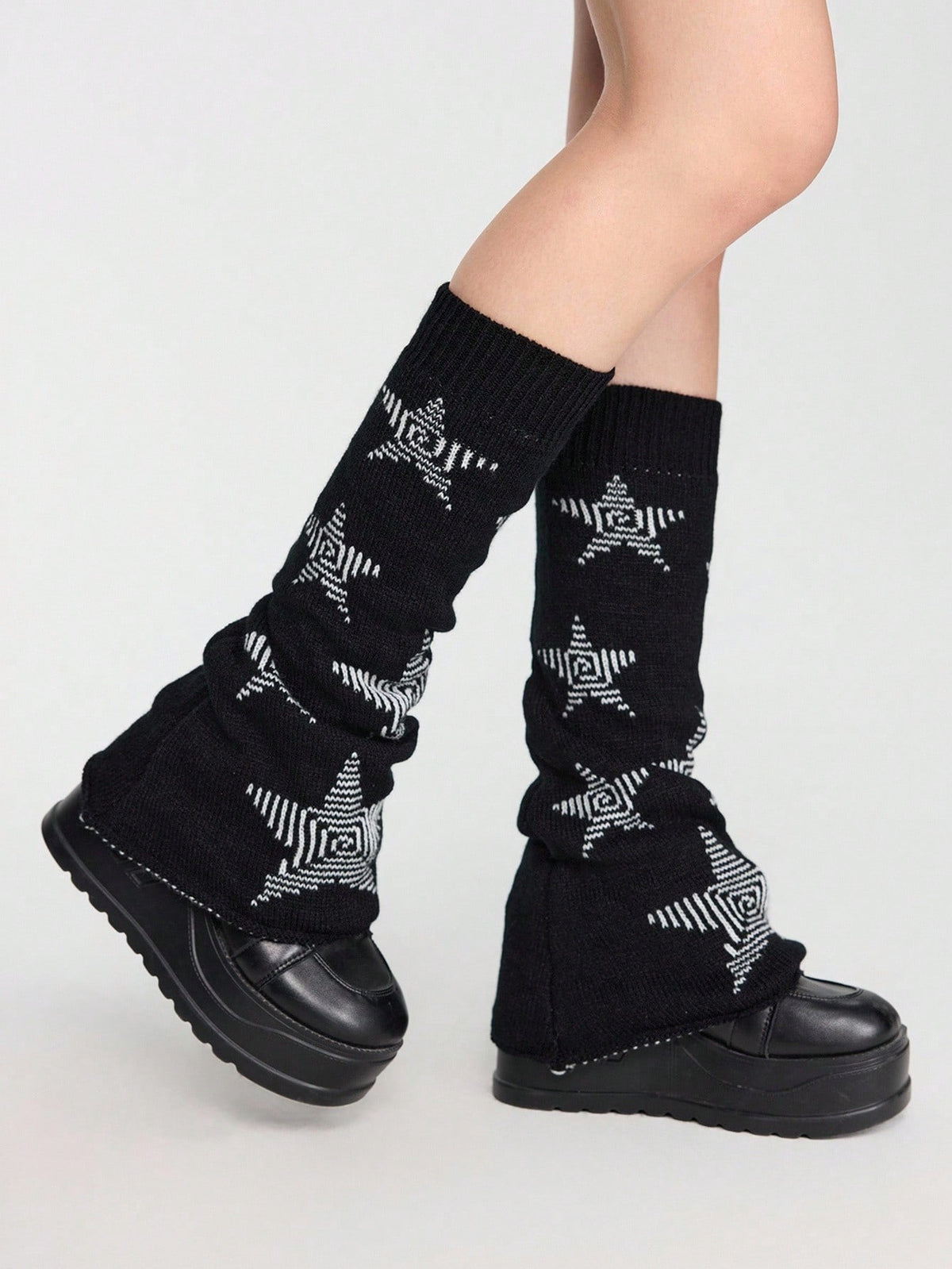 Pair of women's extra long knitted leg warmers featuring a gothic grunge design with subtle ruffle detailing.