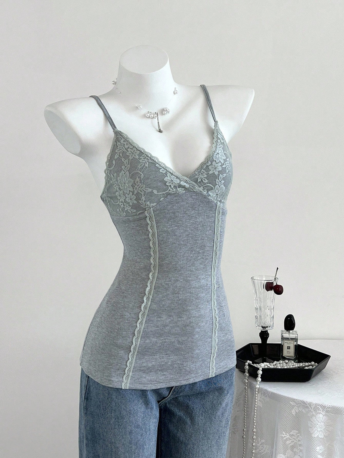 Women's slim fit backless cami tank top with contrast lace patchwork details, spaghetti straps, and high-stretch knitted ribbed fabric.