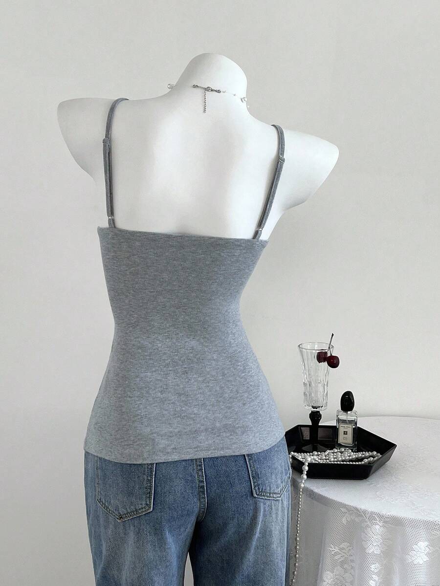 Women's slim fit backless cami tank top with contrast lace patchwork details, spaghetti straps, and high-stretch knitted ribbed fabric.