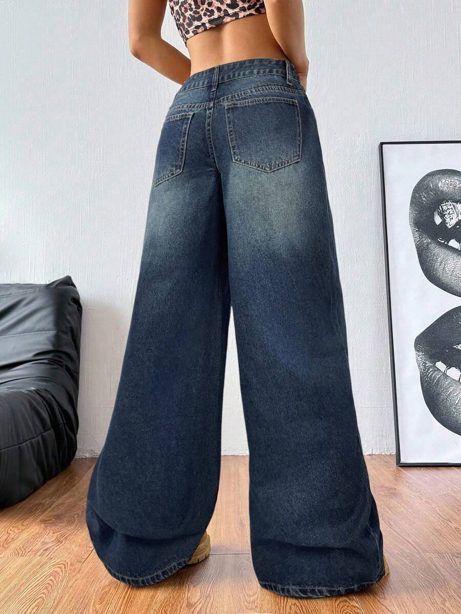 Women's loose wide-leg jeans in light wash denim with low waist and extra-long relaxed fit