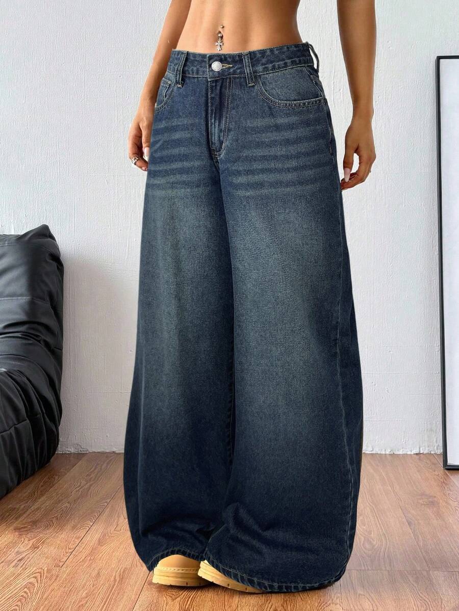 Women's loose wide-leg jeans in light wash denim with low waist and extra-long relaxed fit