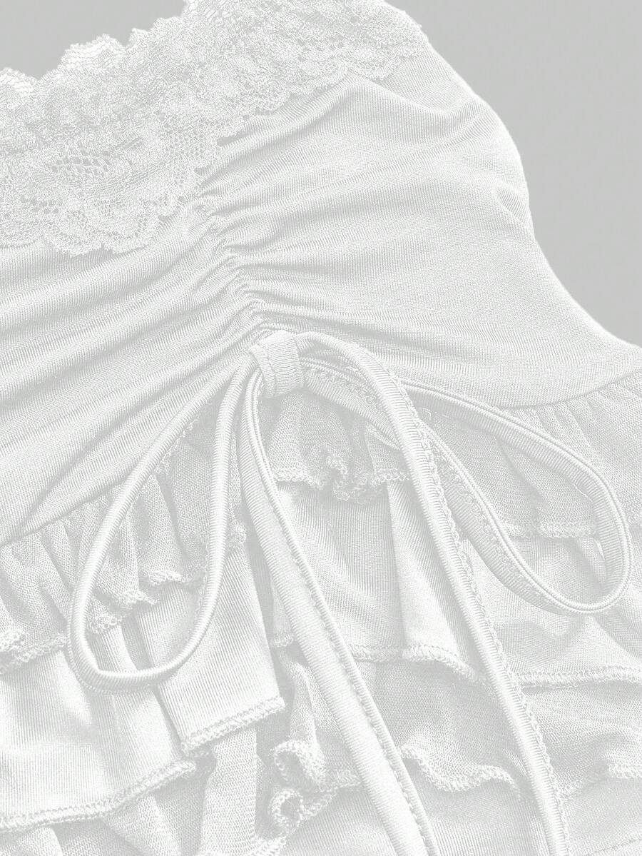 Women's black low-waist mini skirt with drawstring tie, ruched details, lace trim, layered ruffle hem, and asymmetric styling