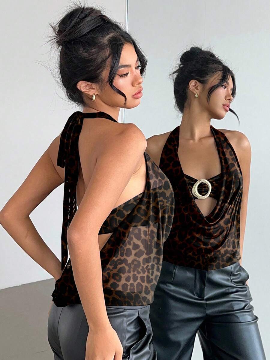 Brown and white polka dot semi-sheer halter camisole top with a plunging neckline, backless design, draped front, and metallic studded embellishments.