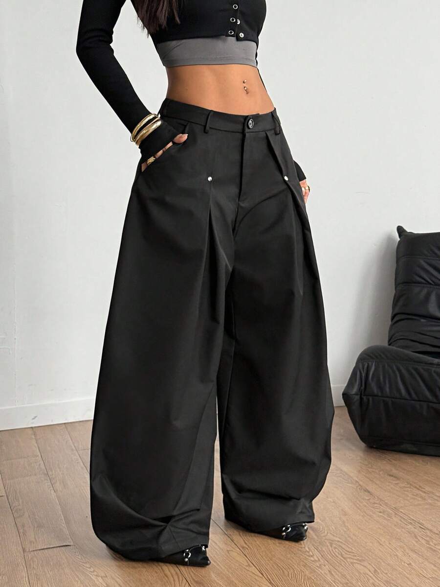 Women's black high-waist wide-leg pants in loose fit woven fabric with button and zipper closure