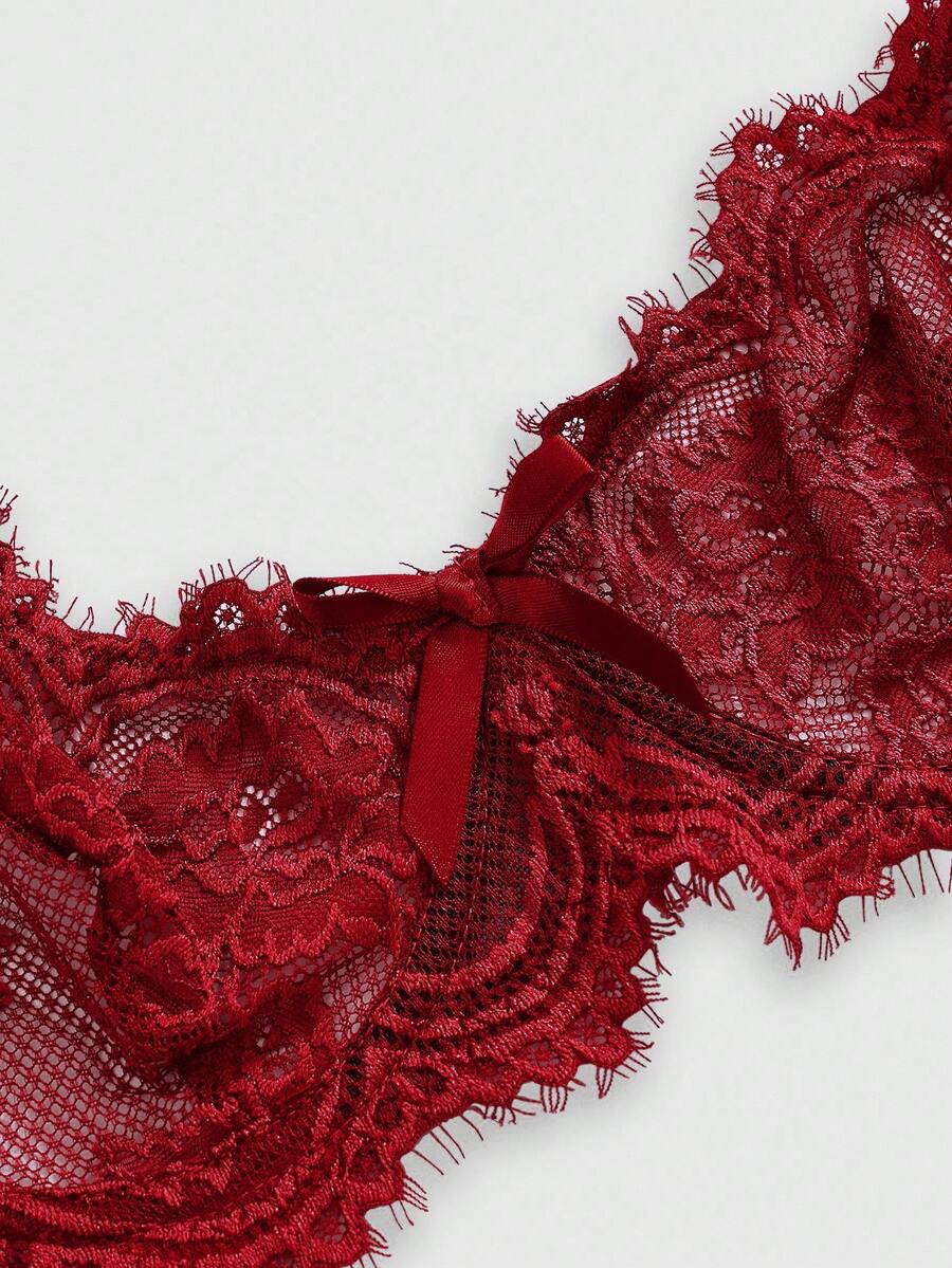 Sheer floral lace underwire triangle bra for women featuring adjustable straps and plunge cup design.