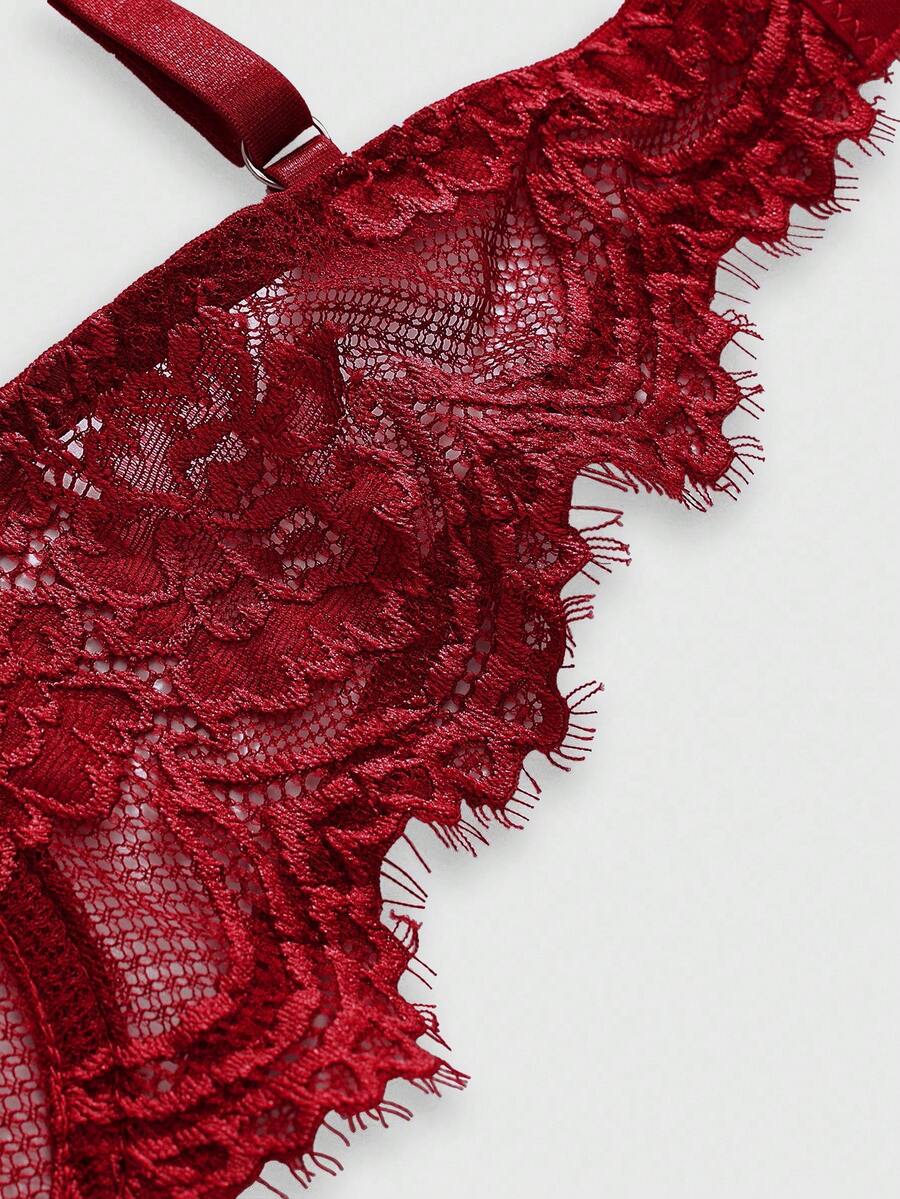 Sheer floral lace underwire triangle bra for women featuring adjustable straps and plunge cup design.