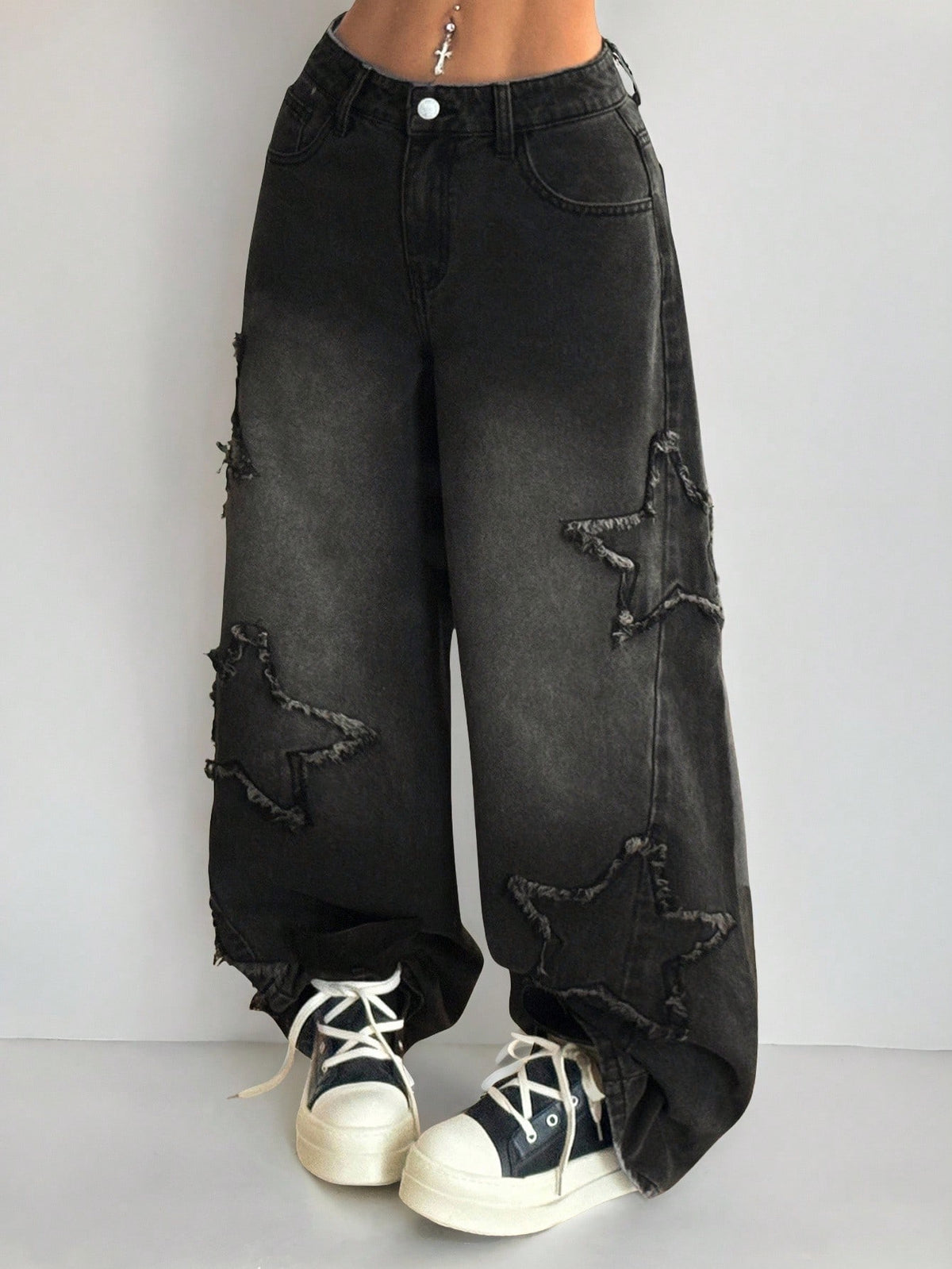 Front view of women's loose wide leg denim jeans featuring a mid waist, classic front pockets, and a zipper fly closure.