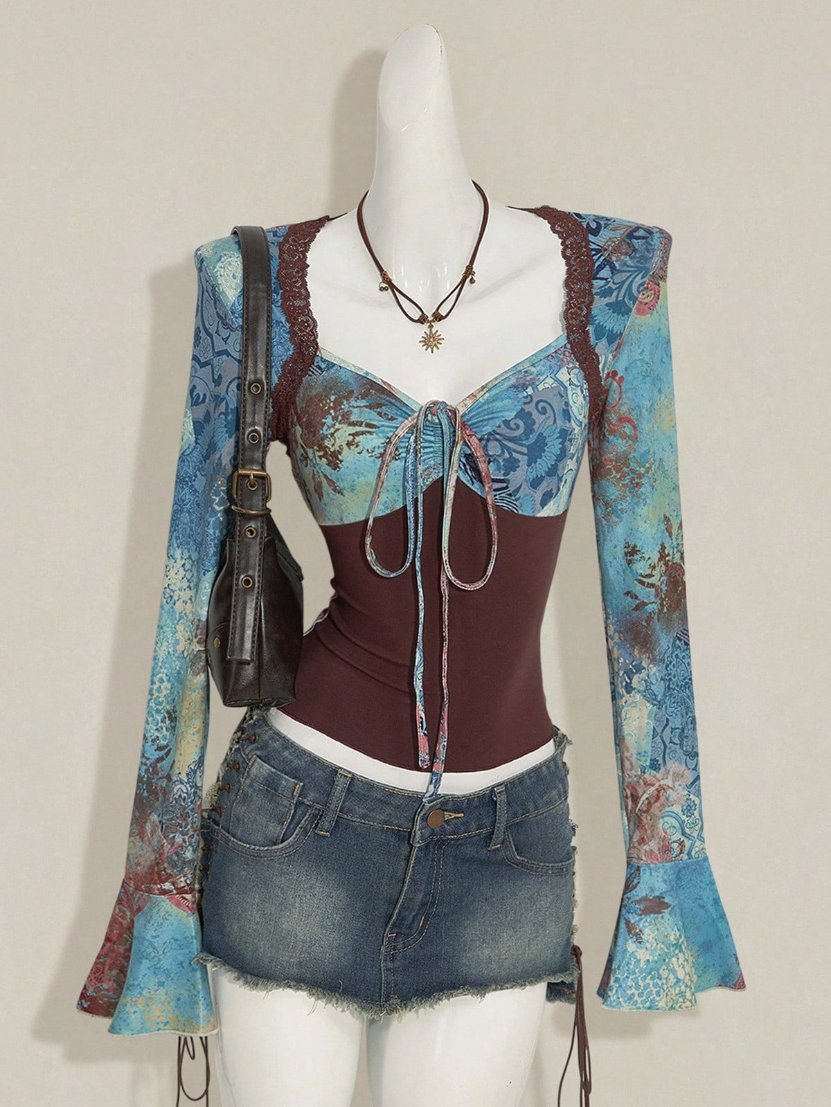 Women's vintage plant print top featuring a sweetheart neckline, flare long sleeves, contrast lace, knot detail, and ruched asymmetrical hem in multicolor.